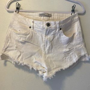 White ripped shorts